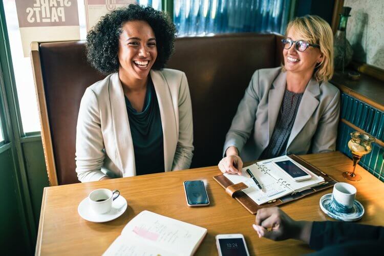 a picture of two happy professional women