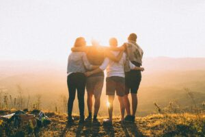 group on a mountaintop in the sun